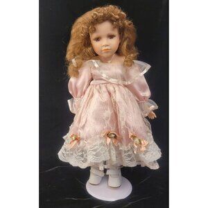 Vintage Collectible Porcelain Doll with Pink Satin and Lace Dress